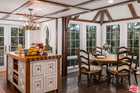 a table and chairs in a dining room with a table and chairs