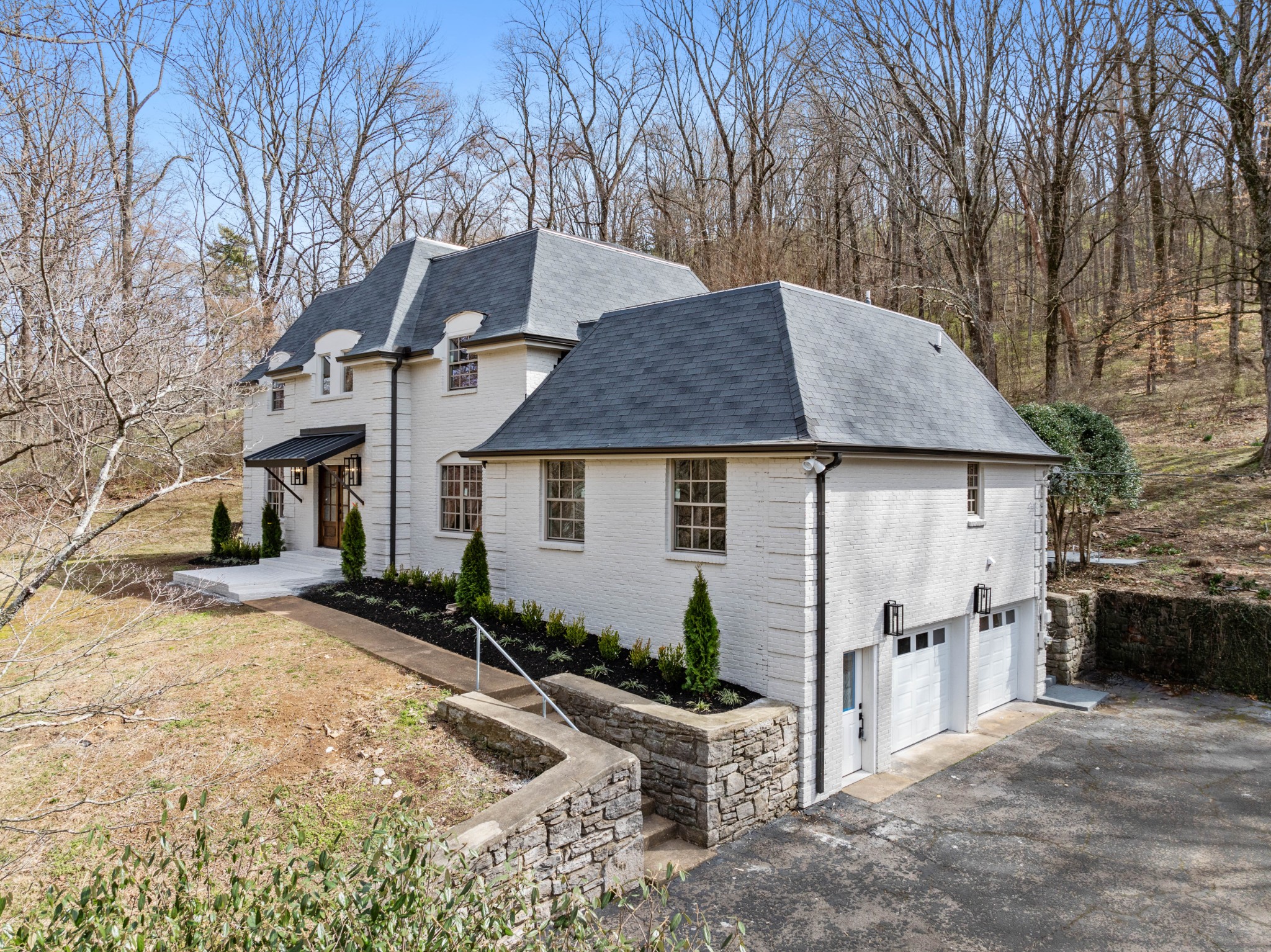 4366 Chickering Lane Nashville, TN 37215 - Photo 27 of 32 a view of a white house with a yard and large tree