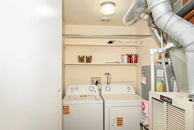 a view of storage and utility room with washer and dryer