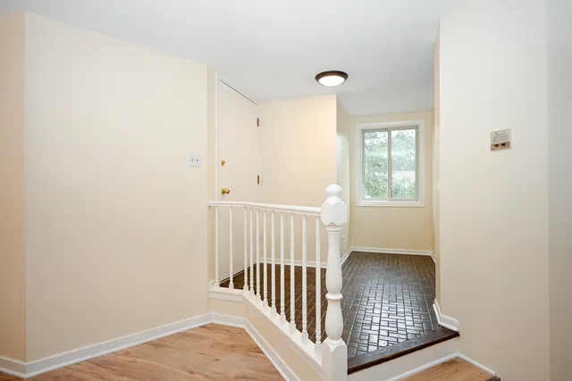 a view of a hallway with a window