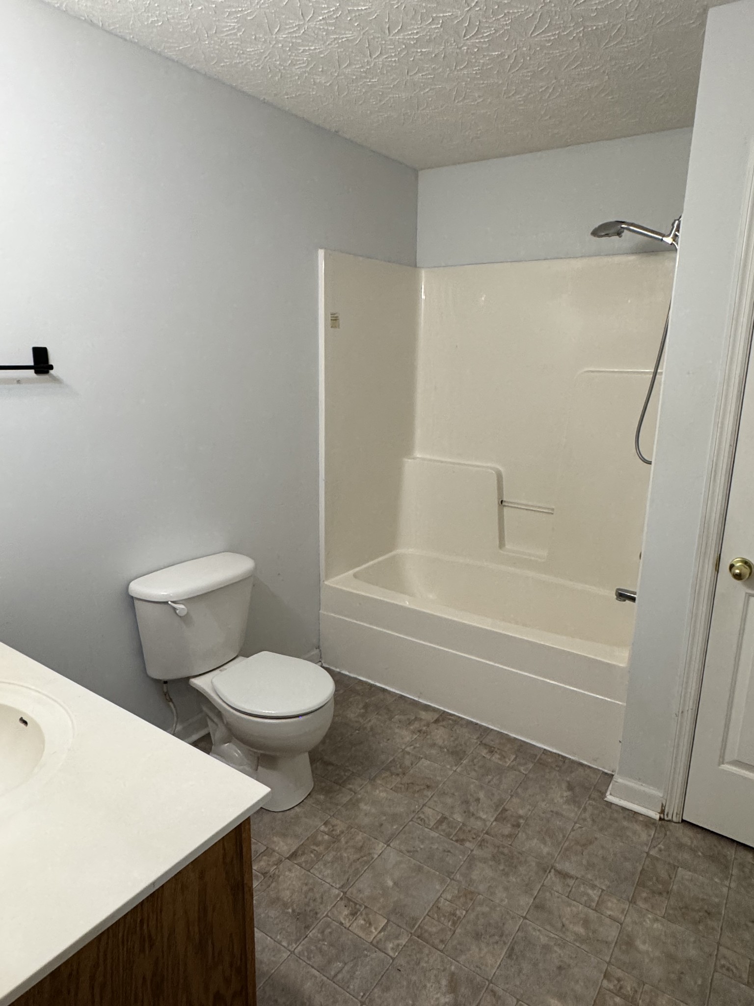 354 Spring Creek Road Lafayette, TN 37083 - Photo 8 of 14 a bathroom with a toilet and a bath tub