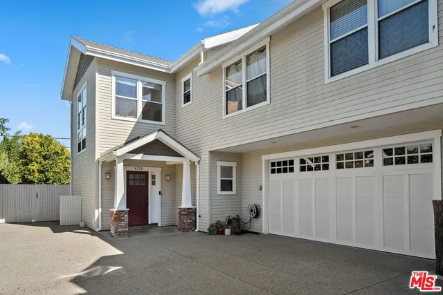 a front view of a house with a garage