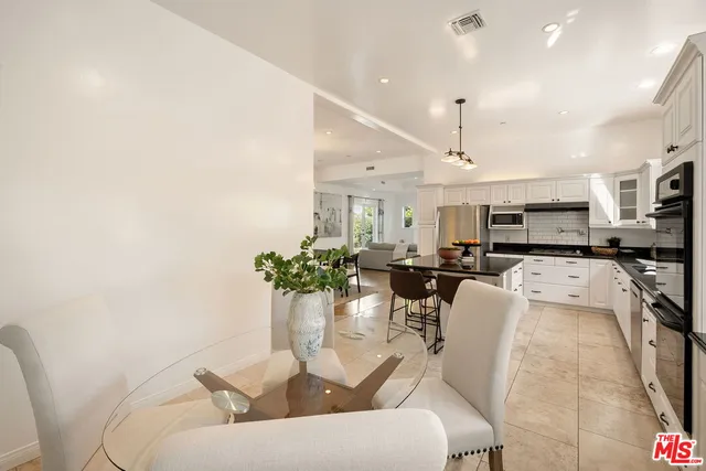 a spacious bathroom with a granite countertop tub sink and mirror