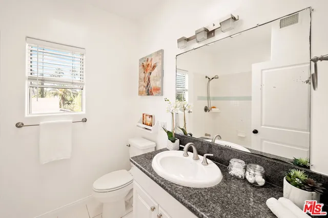 a view of backyard with seating area and green space