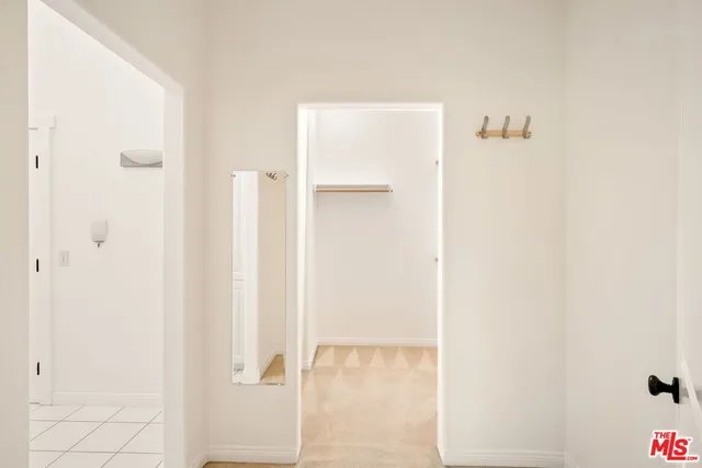 a view of a patio with couches table and chairs and potted plants