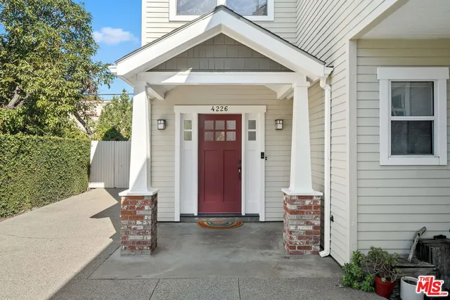 a utility room with a sink and a mirror