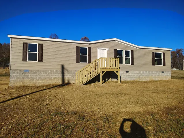a front view of a house with yard