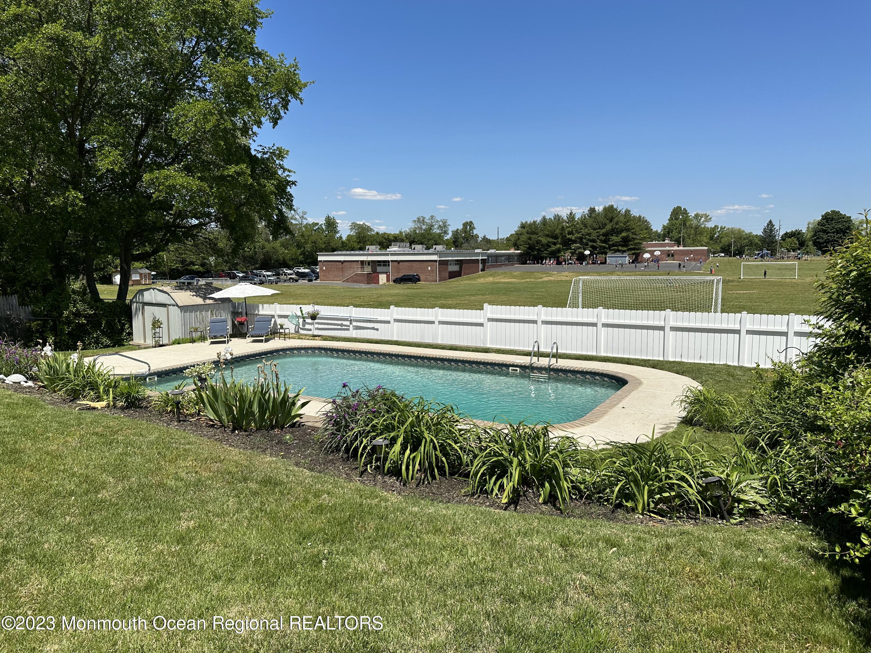 283 Edgemoor Road Belford, NJ 07718 - Photo 27 of 32 Backyard backs to school