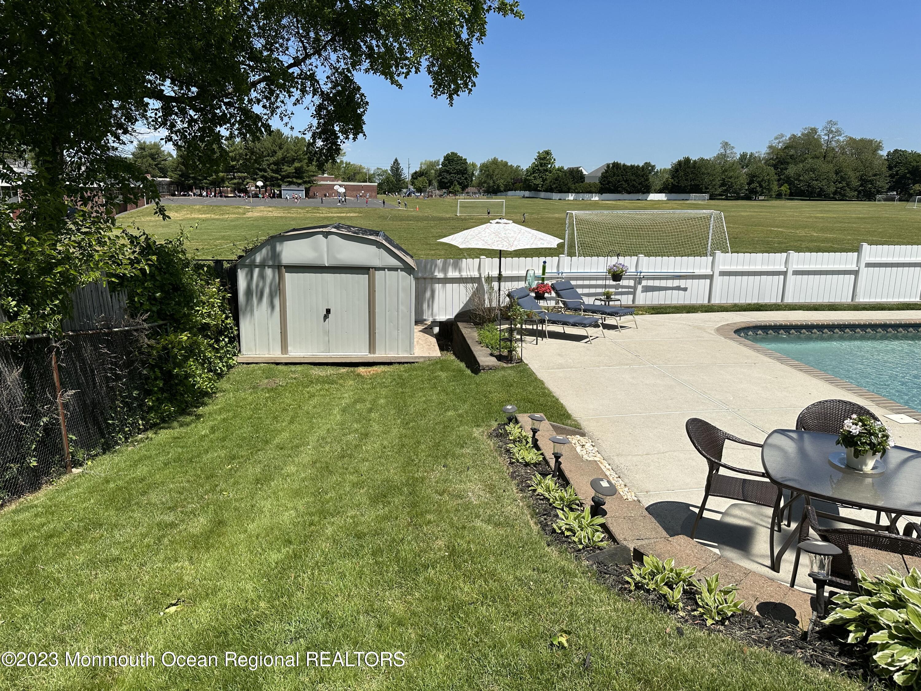 283 Edgemoor Road Belford, NJ 07718 - Photo 28 of 32 Backyard shed and pool area