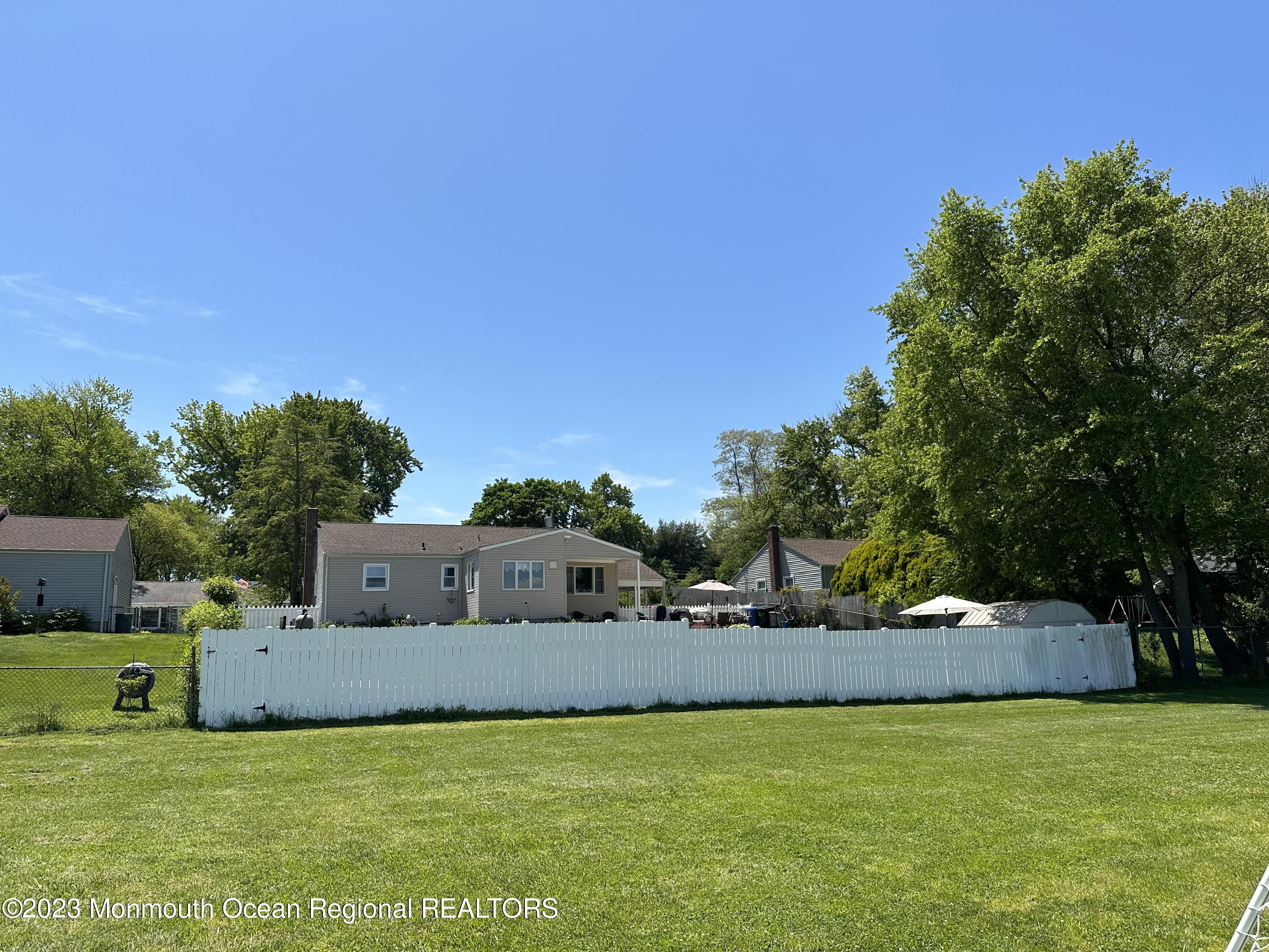 283 Edgemoor Road Belford, NJ 07718 - Photo 32 of 32 Back of home from the field behind