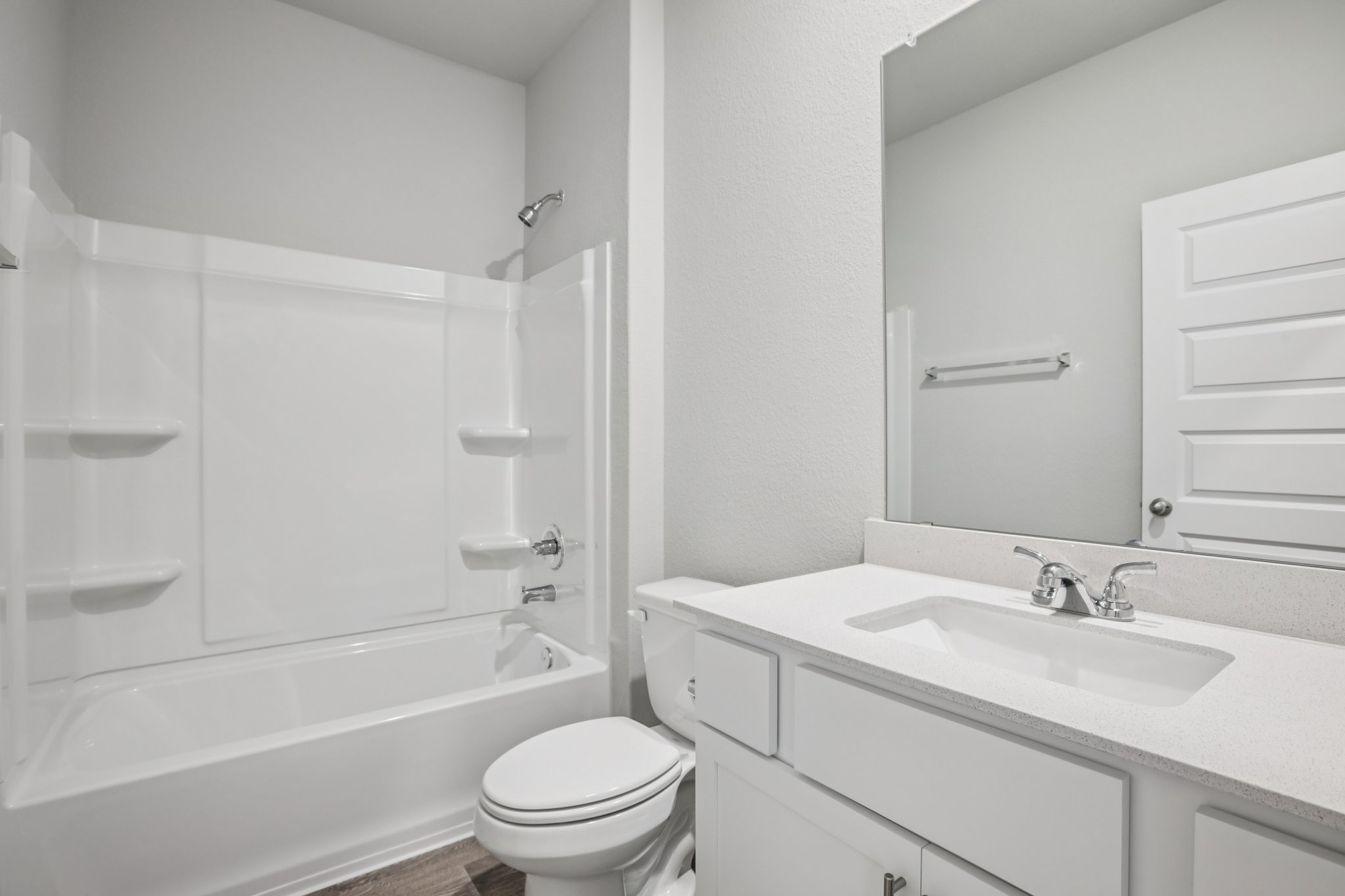 104 Summer Drive Elgin, TX 78621 - Photo 30 of 40 a bathroom with a sink toilet vanity and shower