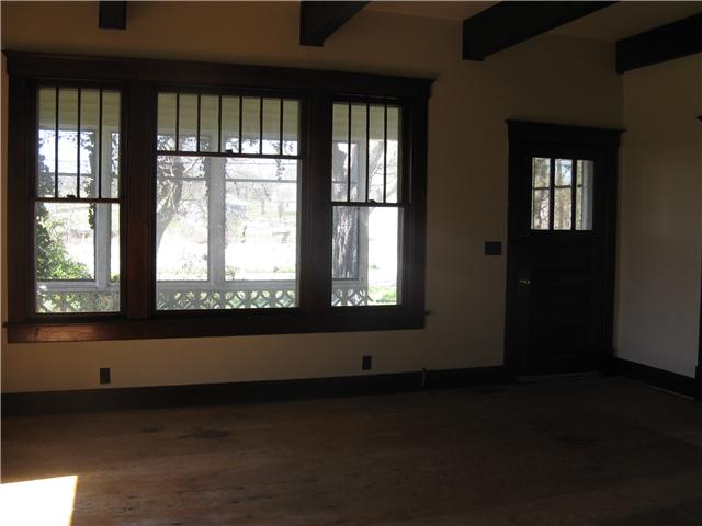10537 Viola Road Morrison, TN 37357 - Photo 3 of 20 Welcoming entry flows into spacious Living Room featuring a ceiling accented by exposed rustic wood beams.