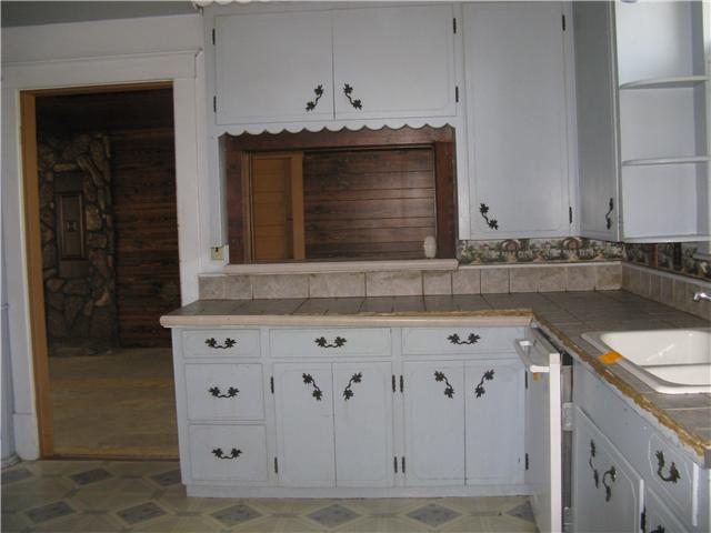 10537 Viola Road Morrison, TN 37357 - Photo 8 of 20 The well organized kitchen has a bright window giving the sink area visual appeal, and a convenient pass through for serving snacks to the den.