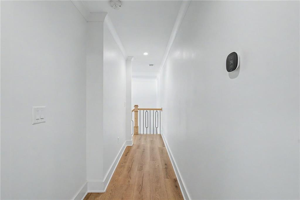 376 Hunnicut Road Southeast Mableton, GA 30126 - Photo 65 of 73 a view of a hallway with wooden floor