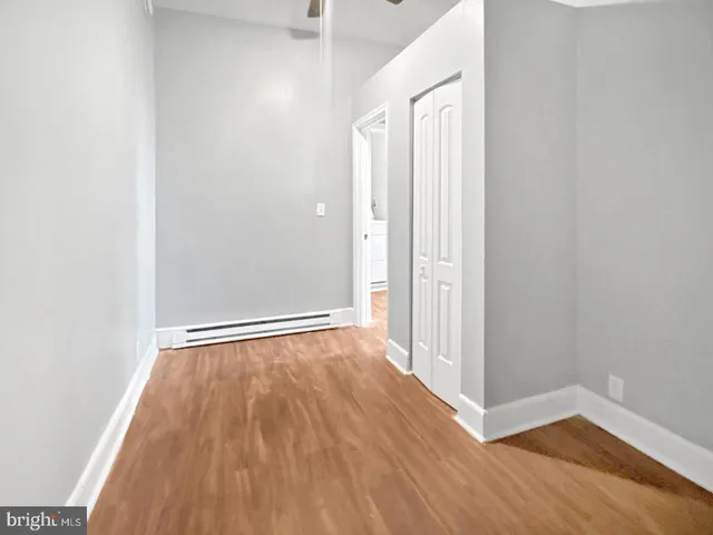 a bathroom with a sink toilet vanity and bathtub