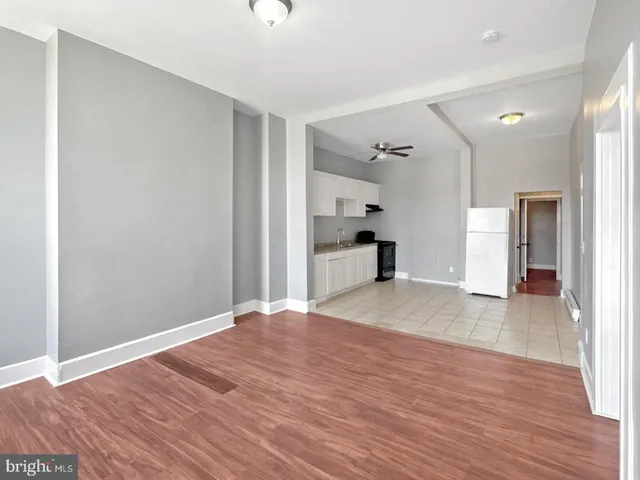 an empty room with wooden floor