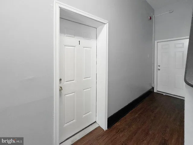a white toilet sitting next to a shower curtain