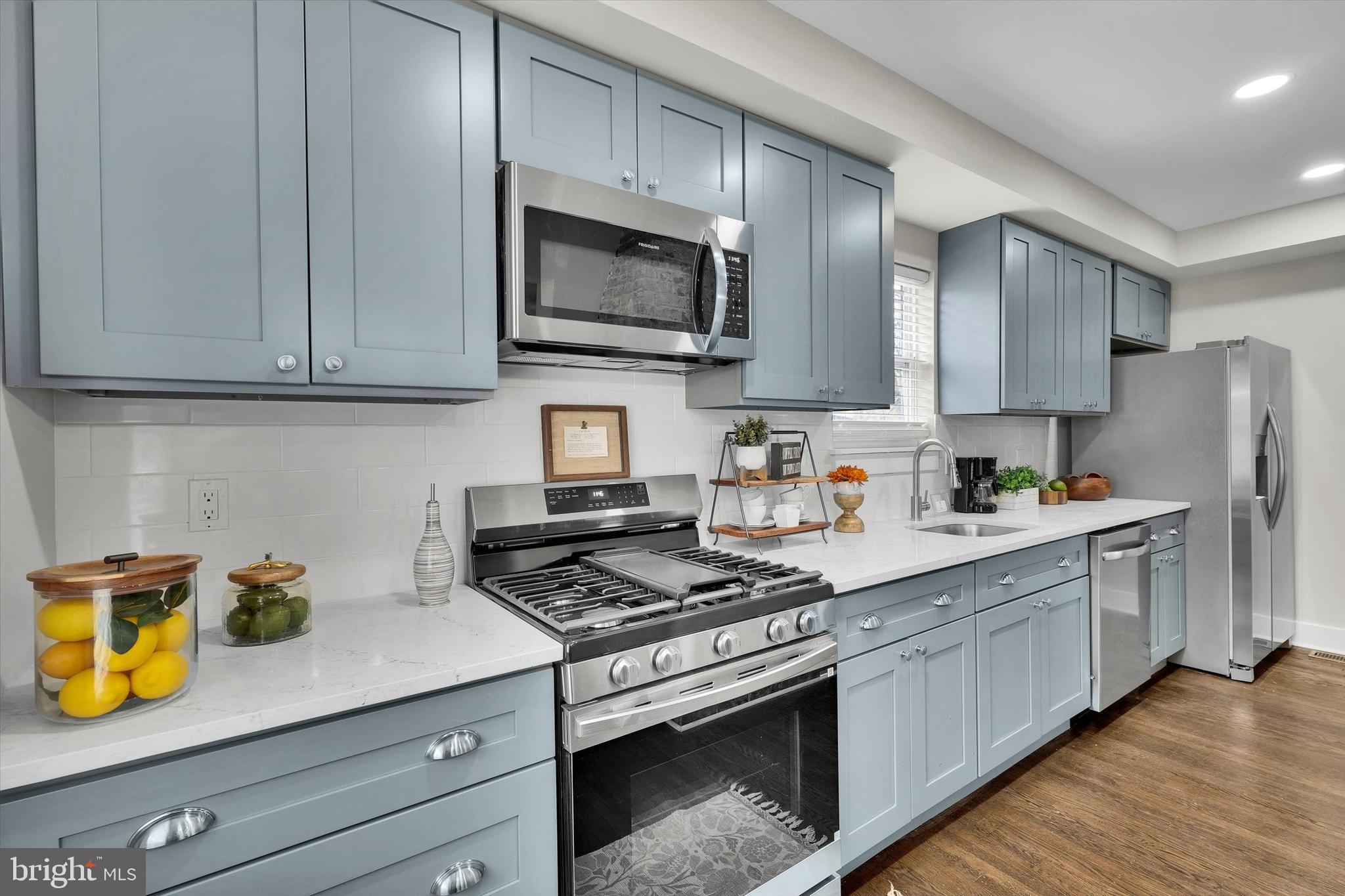 330 Hazel Avenue Delanco, NJ 08075 - Photo 20 of 54 a kitchen with stainless steel appliances granite countertop a sink stove and microwave