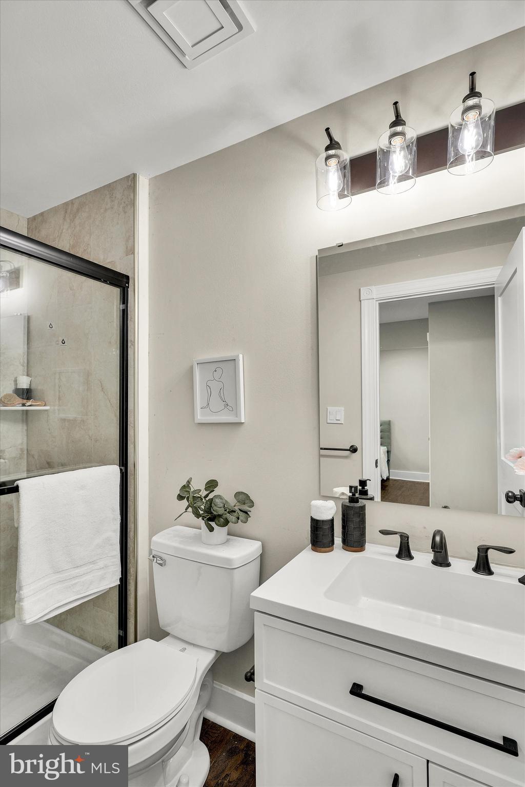 330 Hazel Avenue Delanco, NJ 08075 - Photo 32 of 54 a bathroom with a sink a toilet a mirror and shower