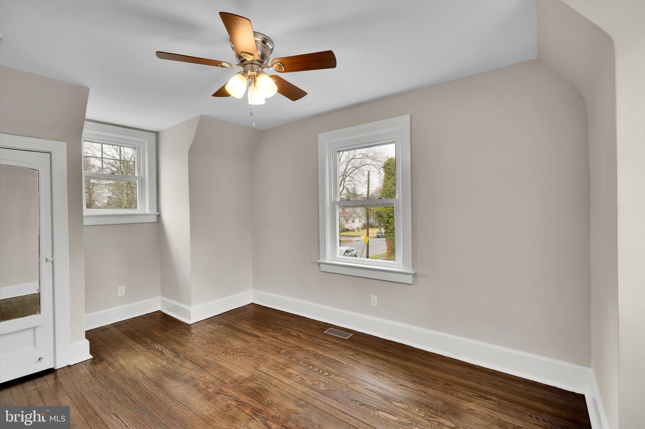 330 Hazel Avenue Delanco, NJ 08075 - Photo 38 of 54 a view of an empty room with wooden floor and a window