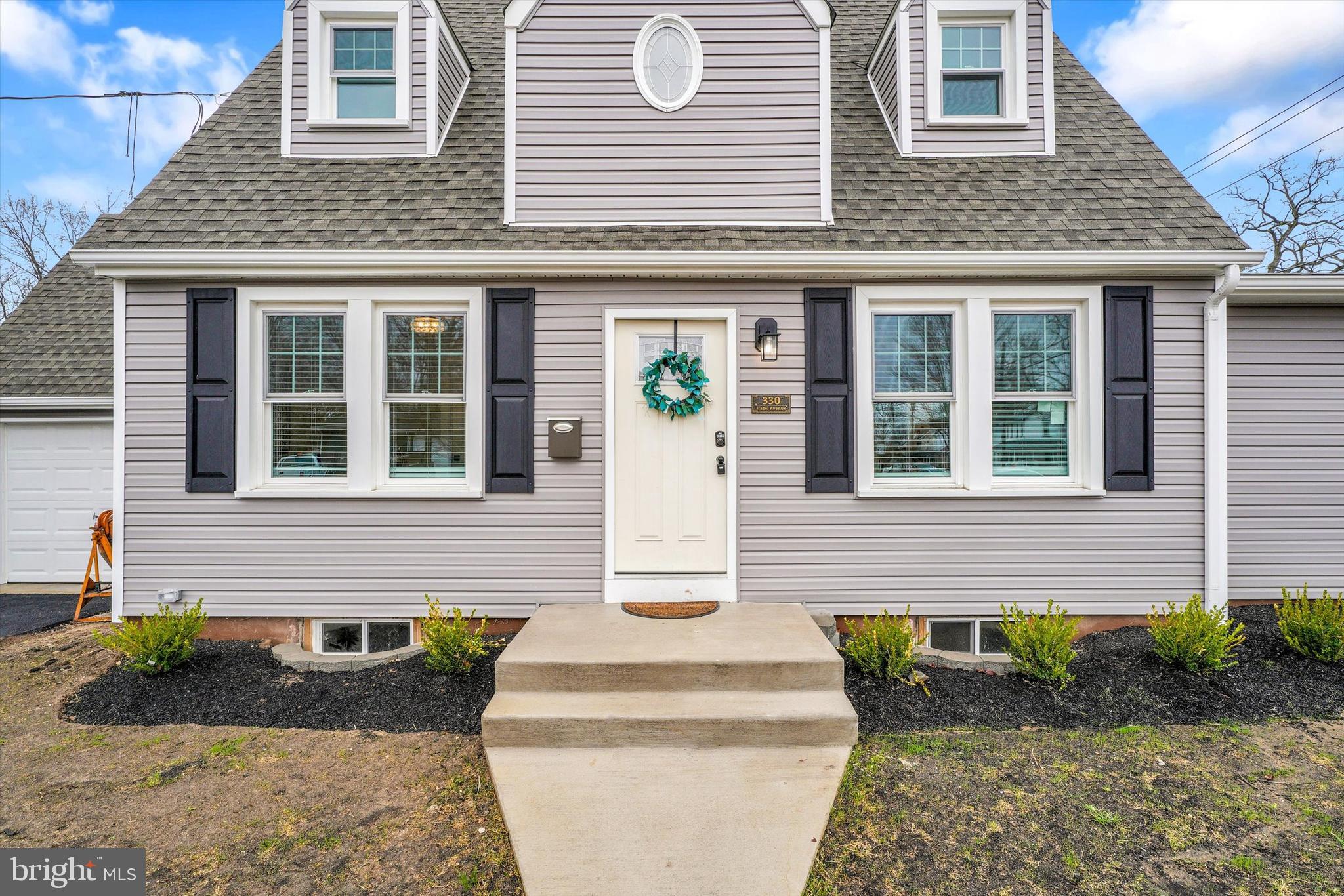 330 Hazel Avenue Delanco, NJ 08075 - Photo 4 of 54 a front view of a house with a garden