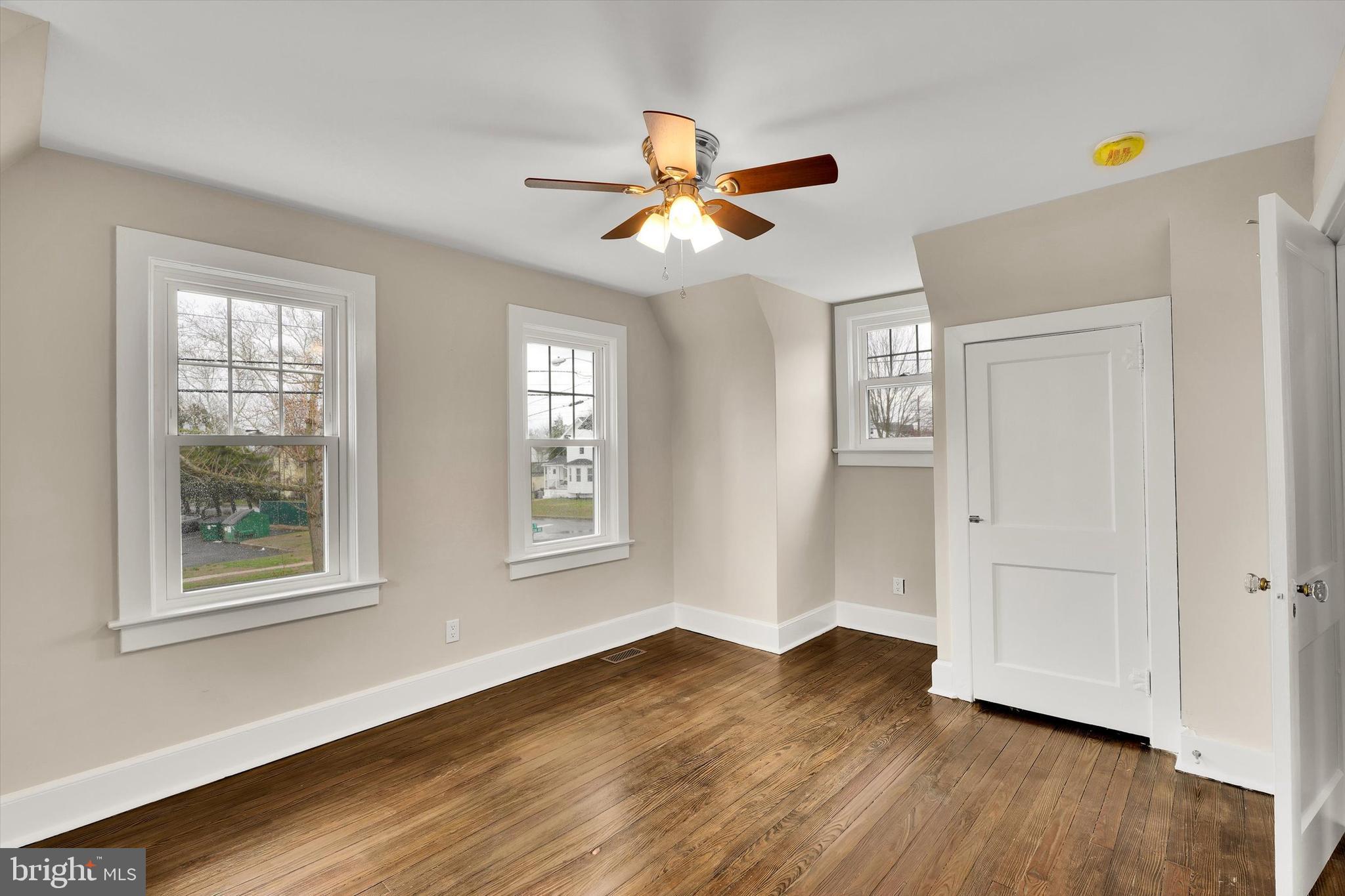 330 Hazel Avenue Delanco, NJ 08075 - Photo 45 of 54 a view of an empty room with wooden floor and a window