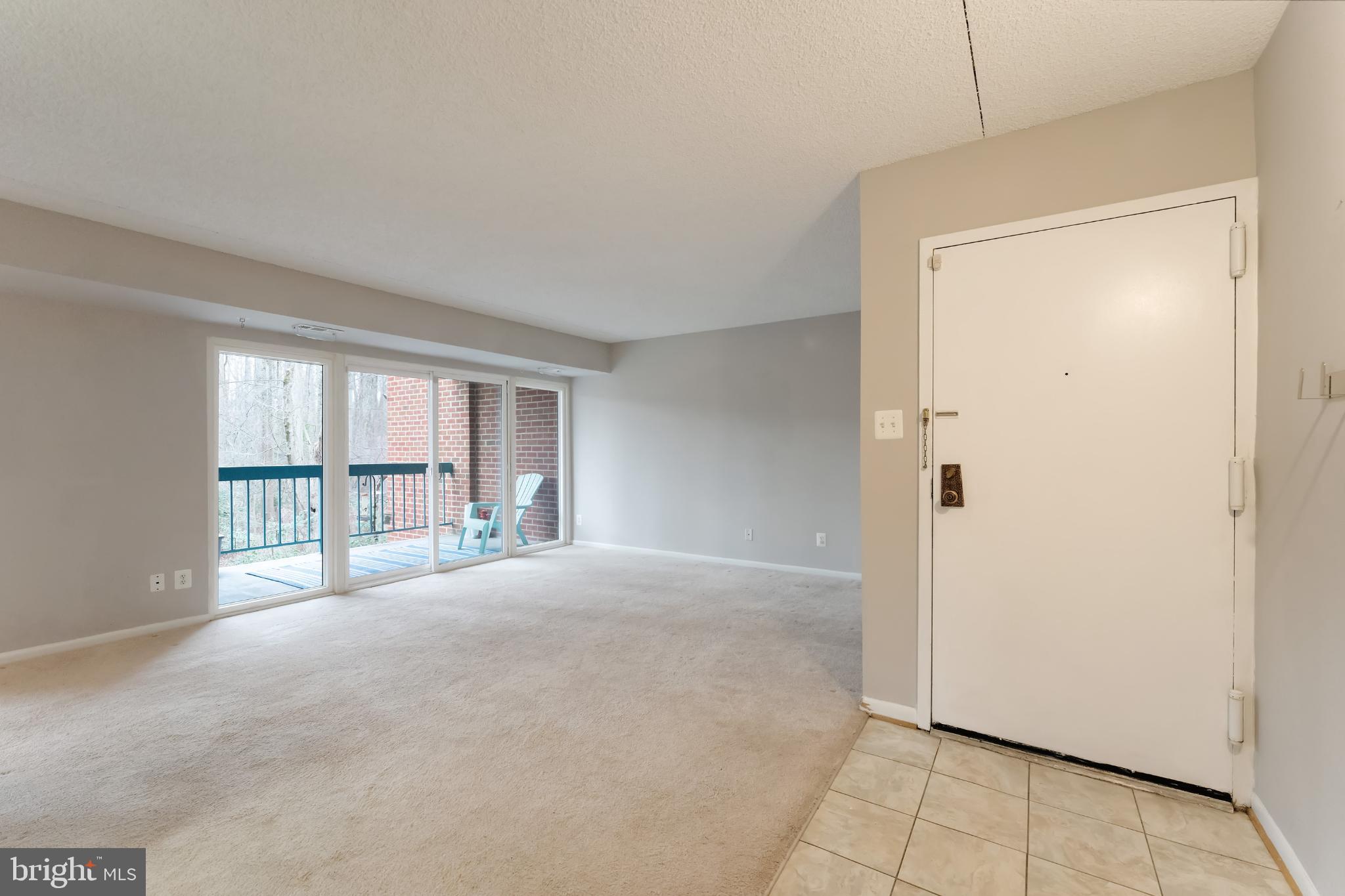 11833 Shire Court, Unit 11B Reston, VA 20191 - Photo 13 of 29 a view of an empty room with a window