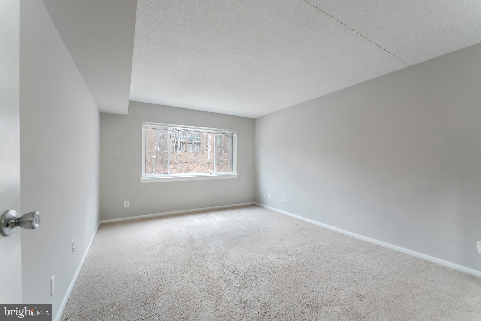 11833 Shire Court, Unit 11B Reston, VA 20191 - Photo 14 of 29 an empty room with windows