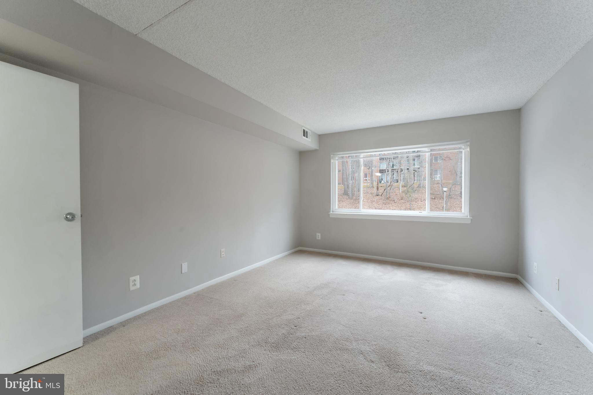11833 Shire Court, Unit 11B Reston, VA 20191 - Photo 16 of 29 an empty room with windows