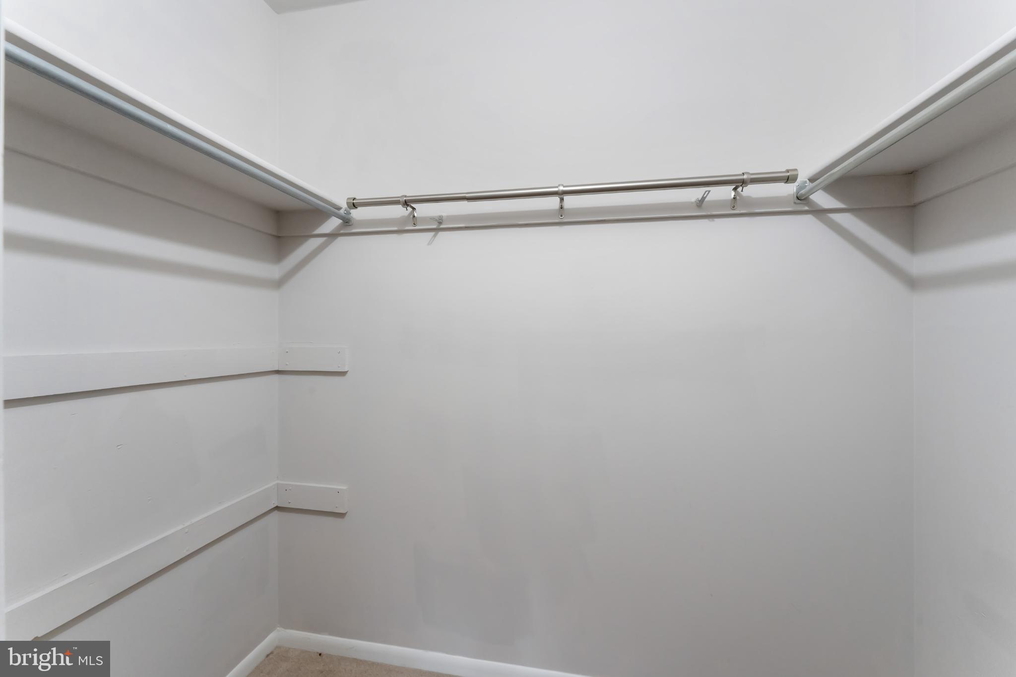 11833 Shire Court, Unit 11B Reston, VA 20191 - Photo 18 of 29 a view of a room with racks on the wall