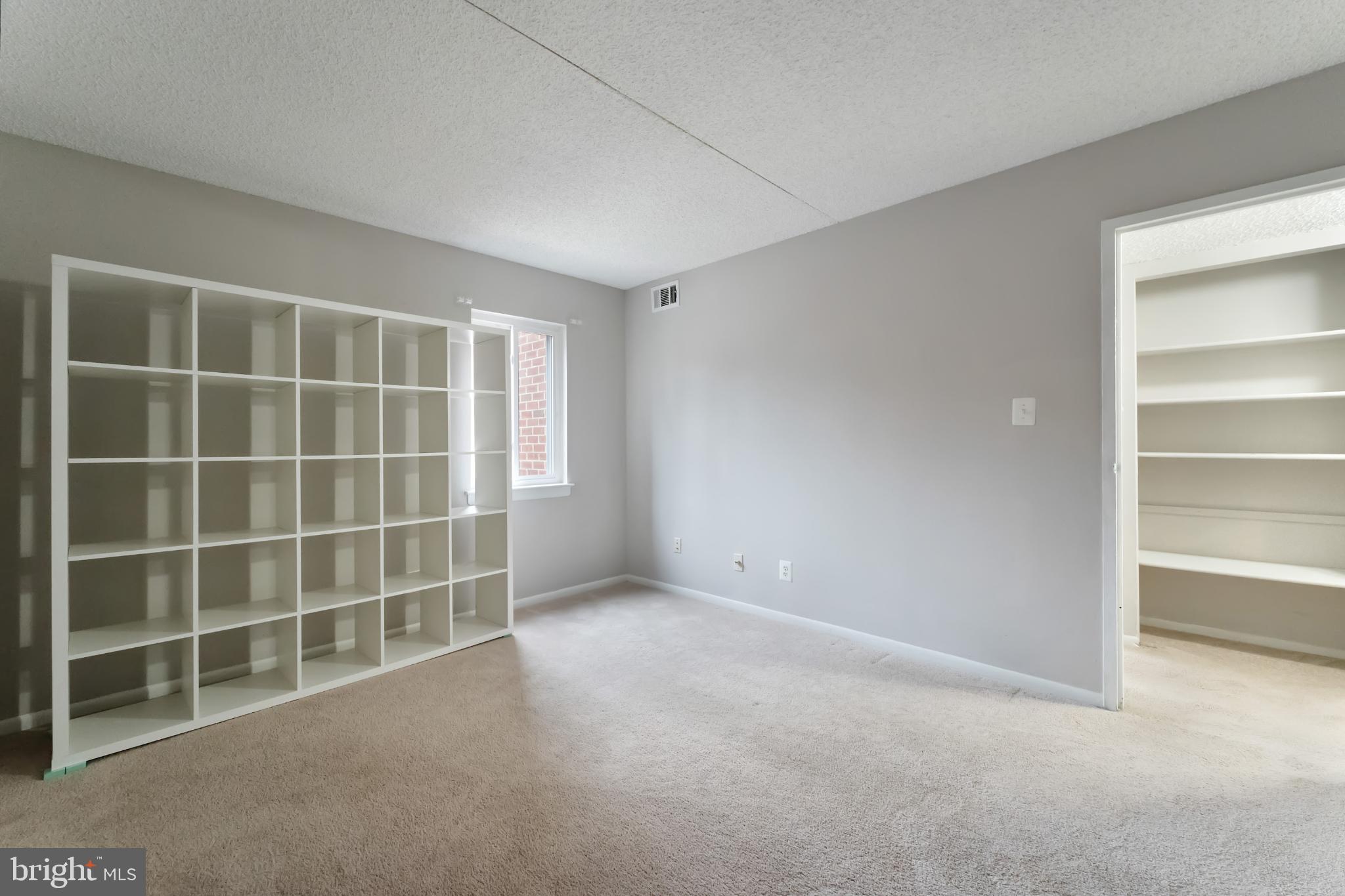 11833 Shire Court, Unit 11B Reston, VA 20191 - Photo 23 of 29 a view of an empty room with empty shelves