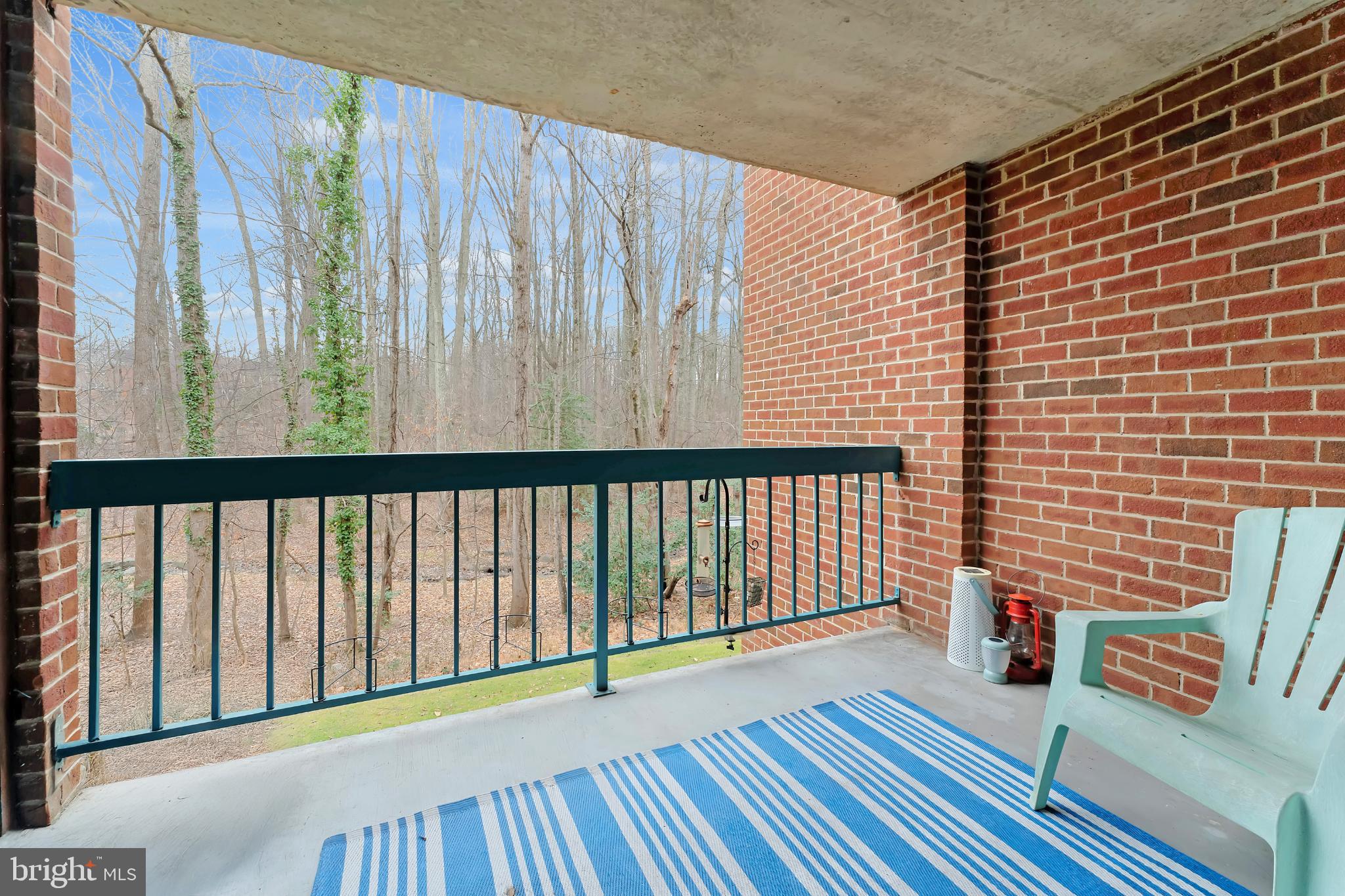 11833 Shire Court, Unit 11B Reston, VA 20191 - Photo 24 of 29 a view of a balcony with wooden floor