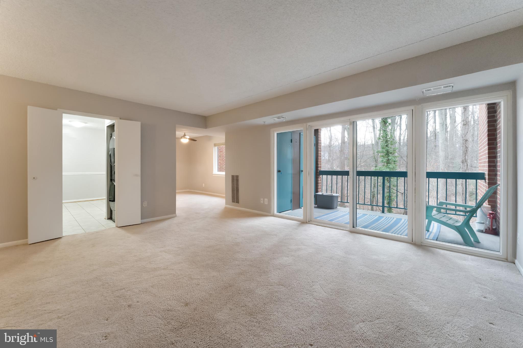11833 Shire Court, Unit 11B Reston, VA 20191 - Photo 3 of 29 a view of an empty room with a balcony