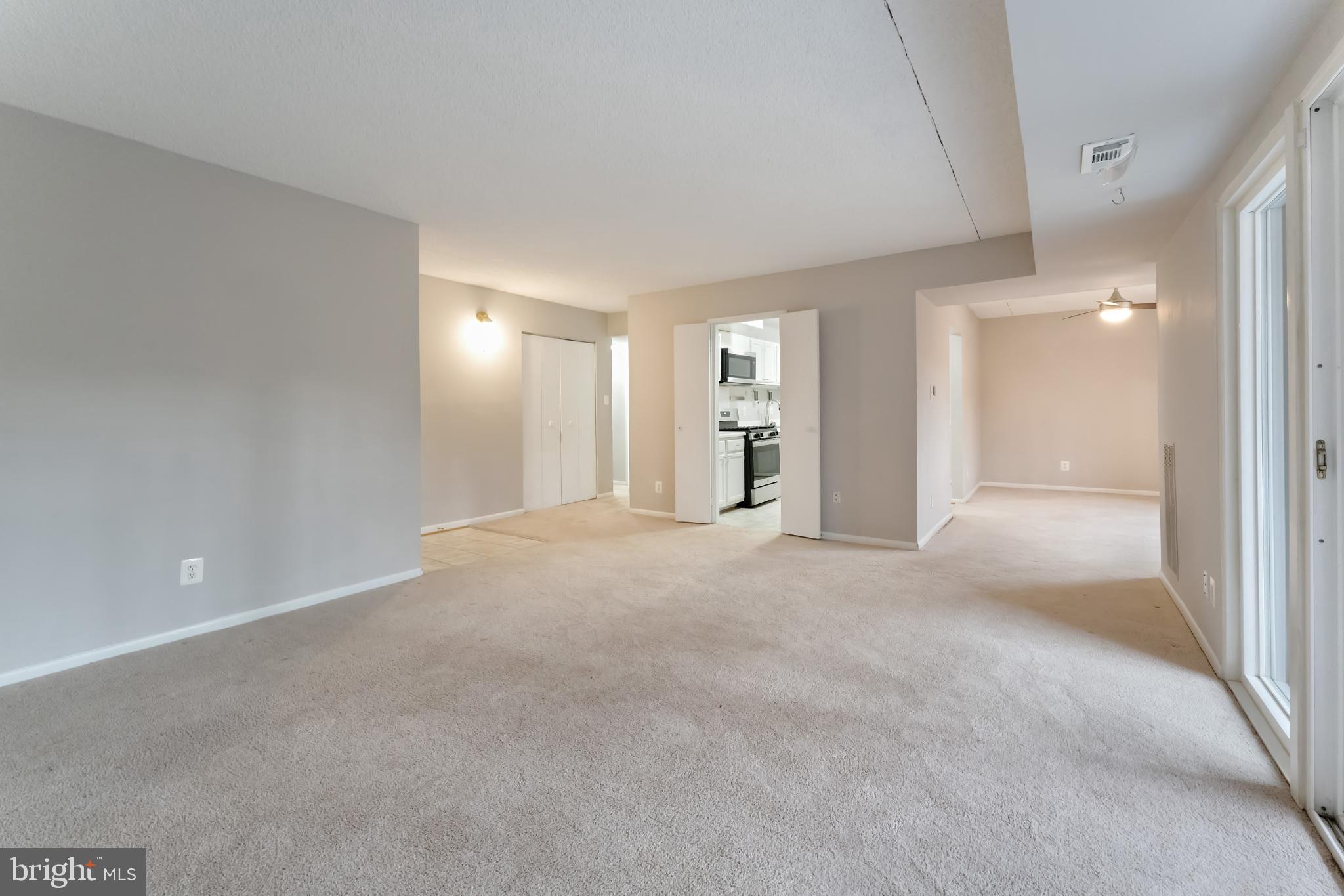 11833 Shire Court, Unit 11B Reston, VA 20191 - Photo 4 of 29 a view of a big room with closet and windows
