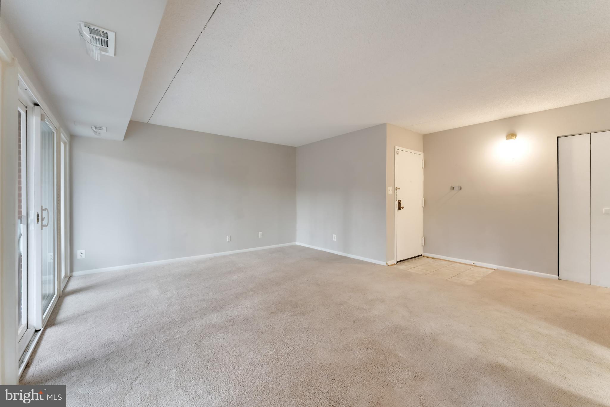 11833 Shire Court, Unit 11B Reston, VA 20191 - Photo 5 of 29 a view of an empty room and a window