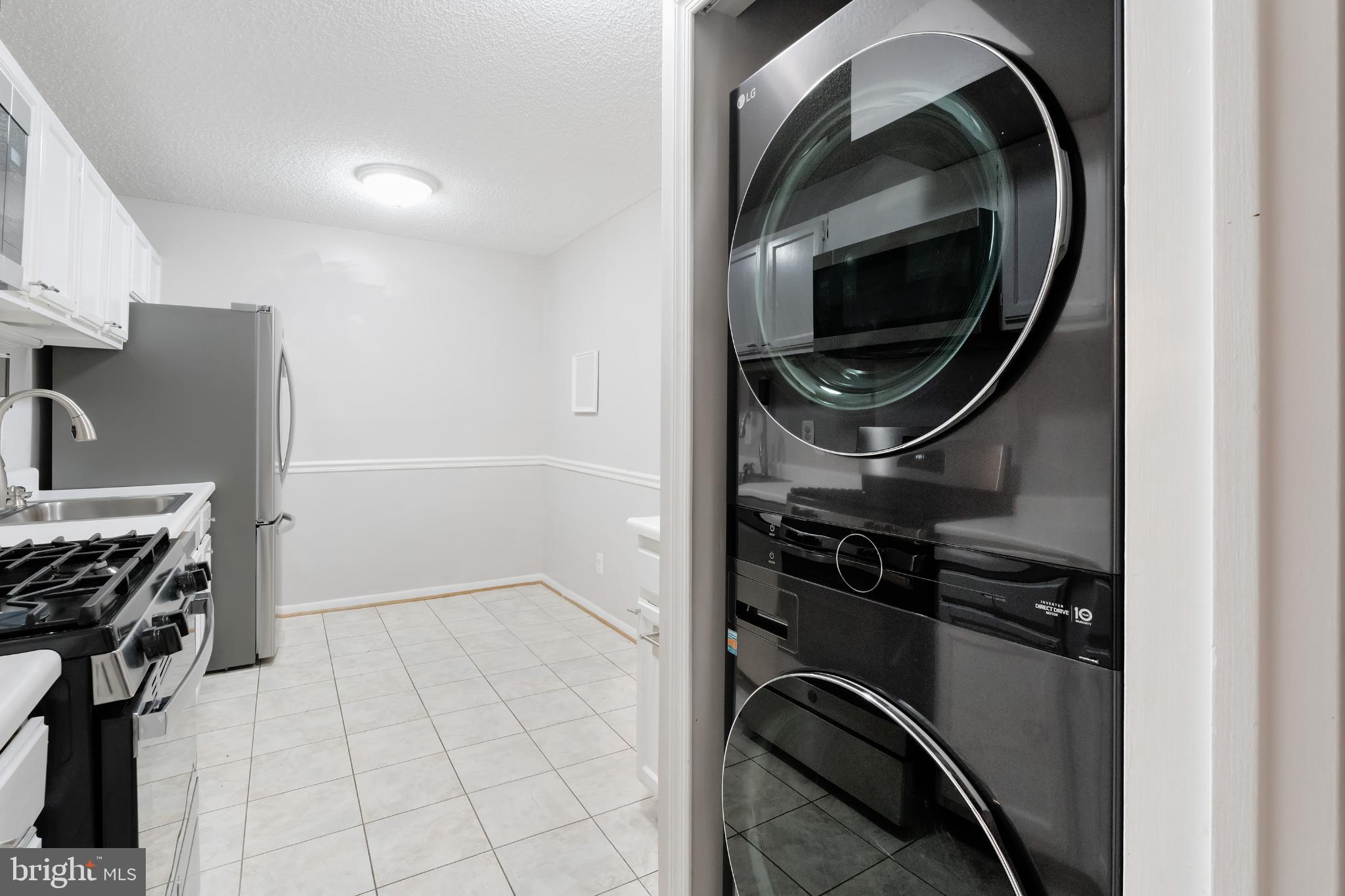 11833 Shire Court, Unit 11B Reston, VA 20191 - Photo 7 of 29 a close up view of a washer and dryer
