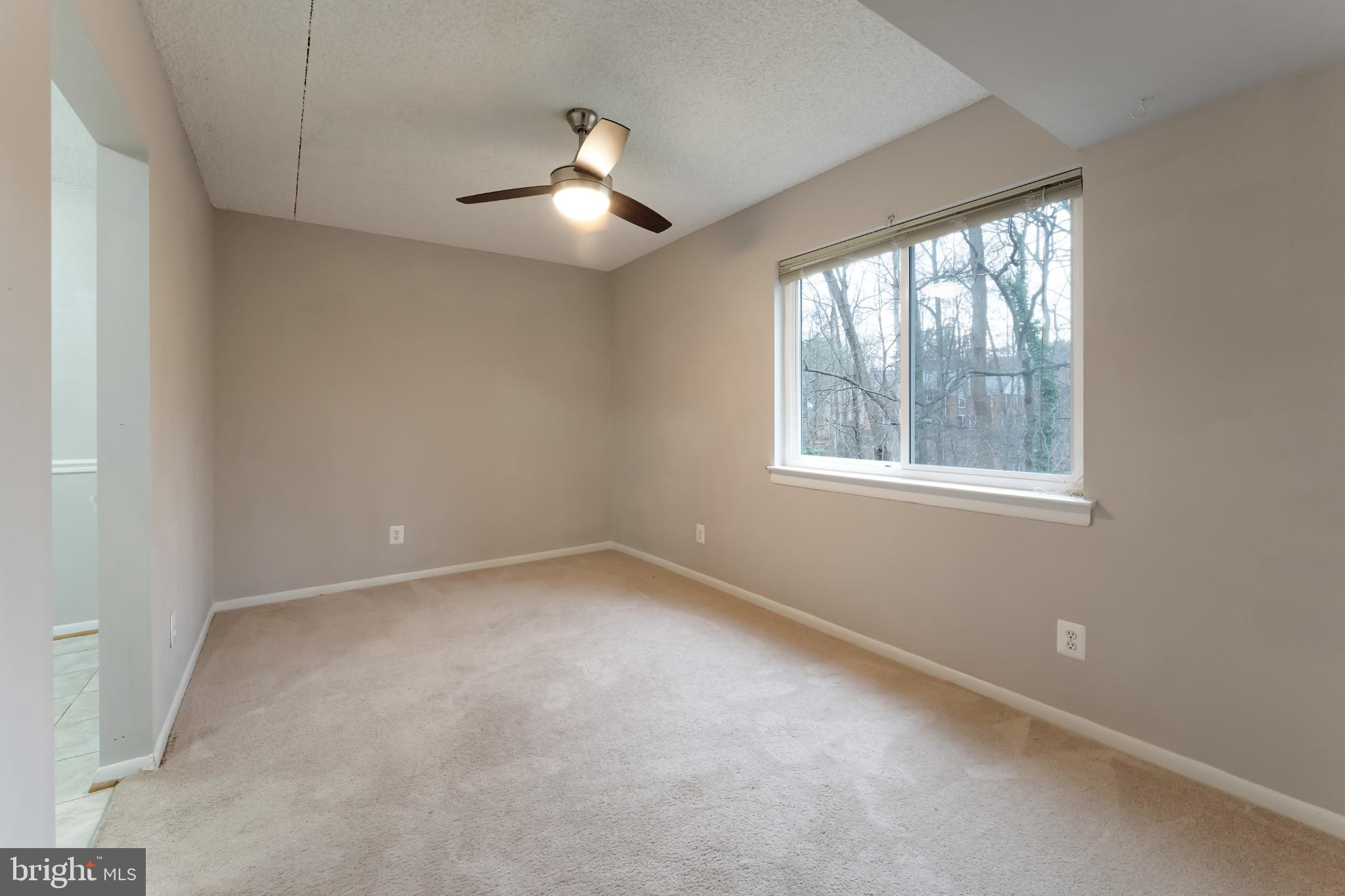 11833 Shire Court, Unit 11B Reston, VA 20191 - Photo 10 of 29 an empty room with a window