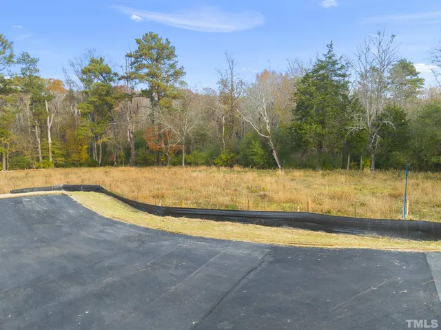 a view of a swimming pool with an outdoor space and seating area
