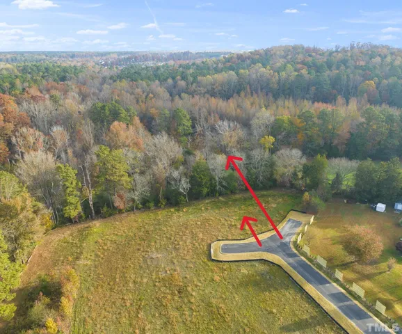 a view of swimming pool with a yard and mountain view