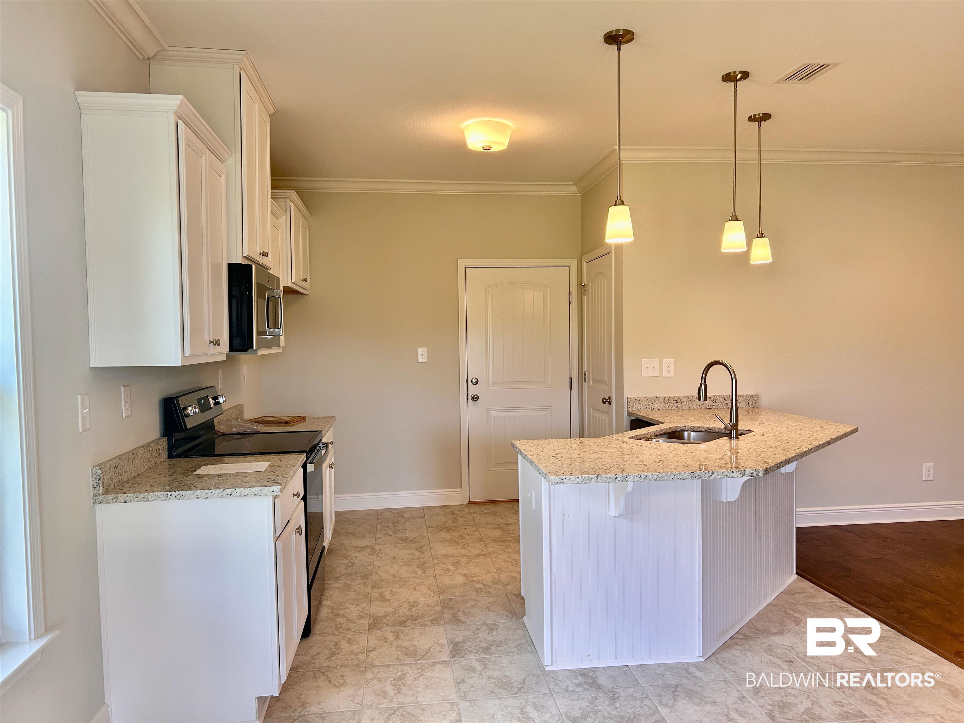 1267 Pembroke Way Foley, AL 36535 - Photo 8 of 17 Kitchen featuring light stone countertops, light hardwood / wood-style floors, electric range, sink, and white cabinets