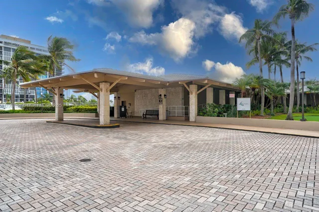 a balcony with table and chairs