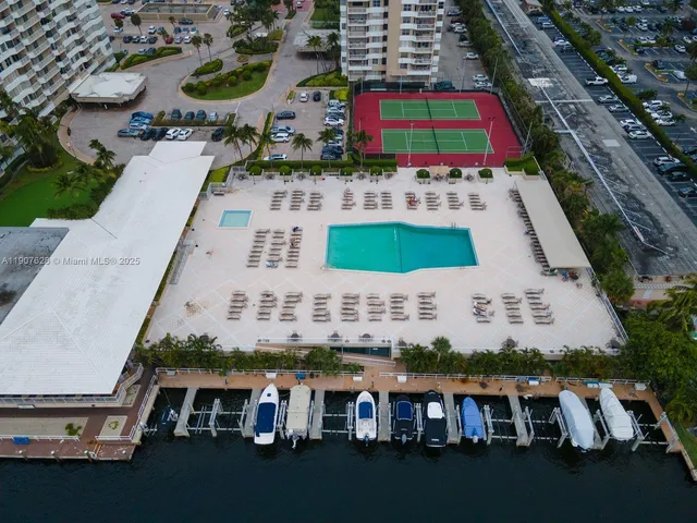 an aerial view of house with yard swimming pool and outdoor seating
