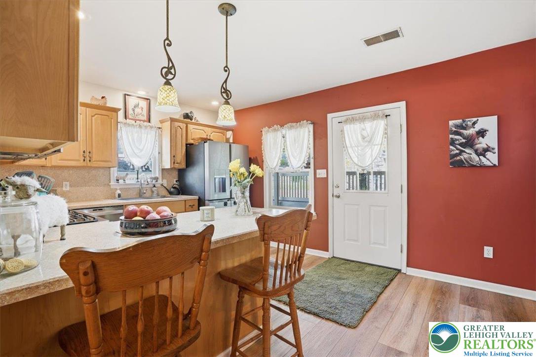 4880 Little Gap Road Kunkletown, PA 18058 - Photo 20 of 100 This warm kitchen features an inviting eat-in island, perfect for casual dining and entertaining.