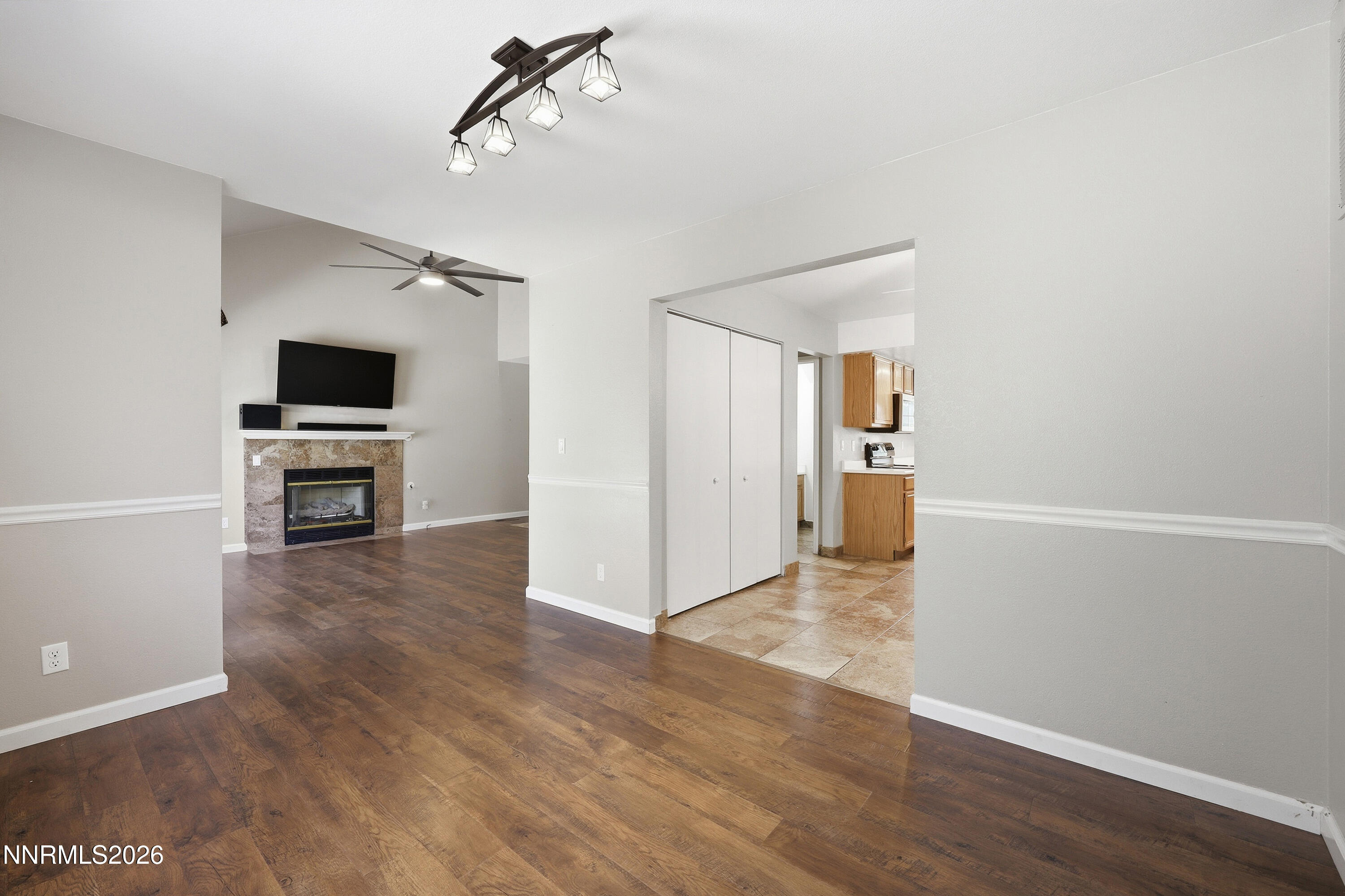 1899 Tuolumne Drive Reno, NV 89523 - Photo 10 of 44 a view of a livingroom with wooden floor and a kitchen