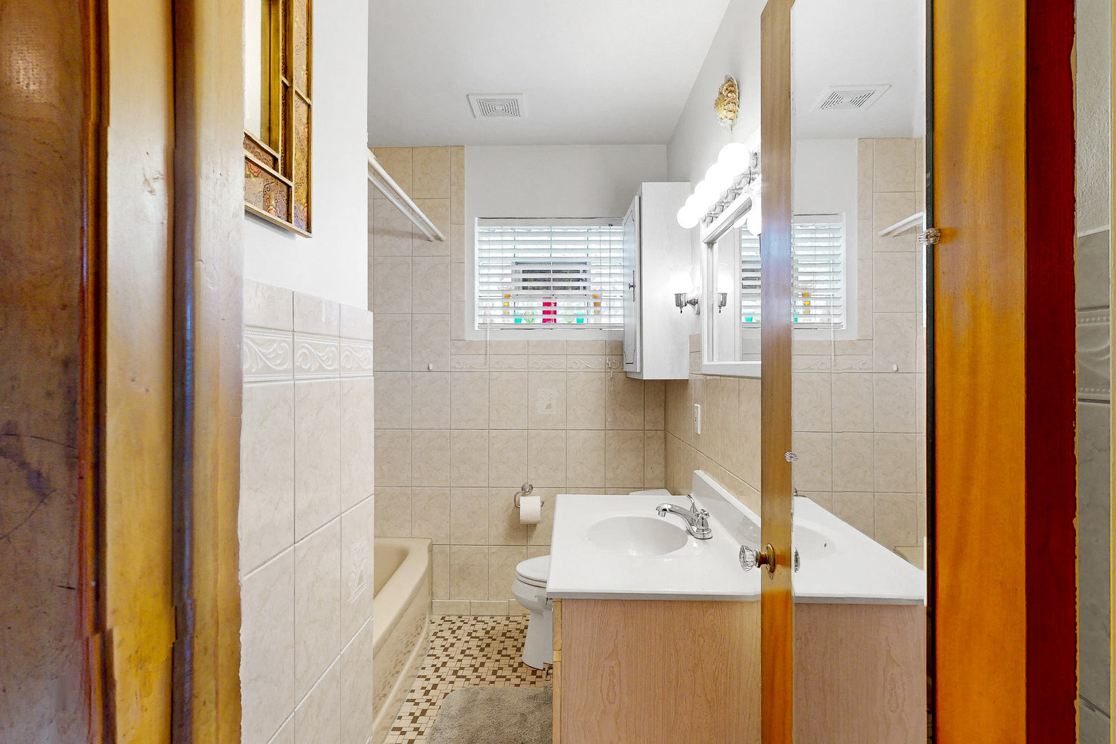 6923 29th Street Berwyn, IL 60402 - Photo 11 of 23 a bathroom with a sink and a mirror