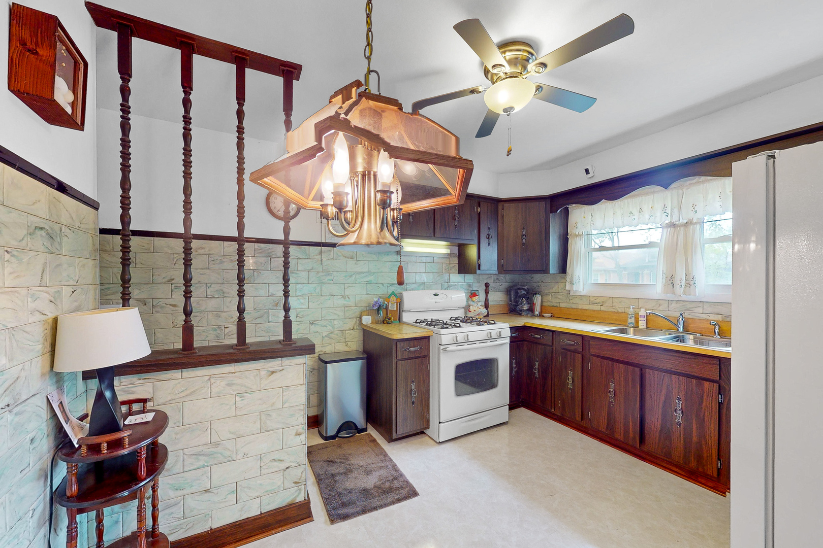 6923 29th Street Berwyn, IL 60402 - Photo 5 of 23 a kitchen with stainless steel appliances granite countertop a sink and cabinets
