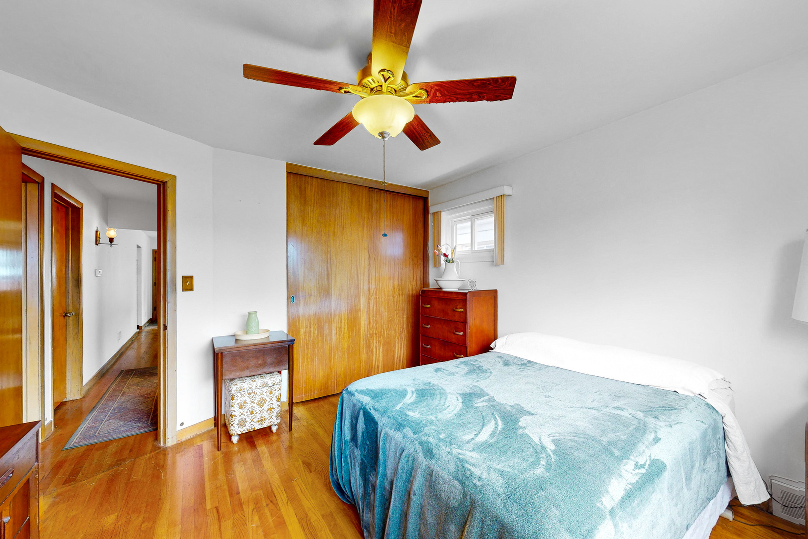 6923 29th Street Berwyn, IL 60402 - Photo 8 of 23 a bedroom with a bed and wooden floor