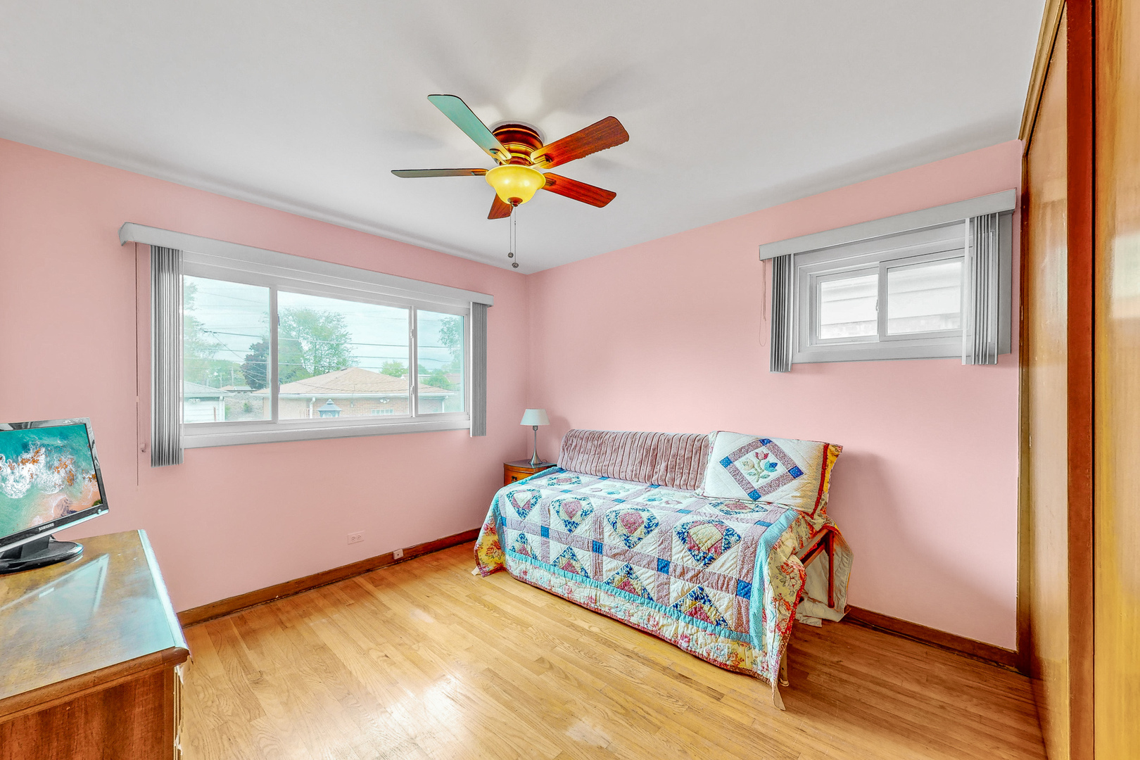 6923 29th Street Berwyn, IL 60402 - Photo 9 of 23 a bedroom with a bed and a window