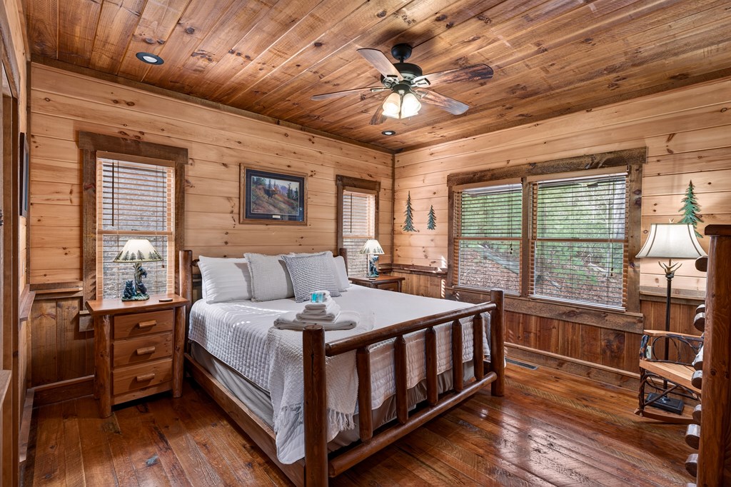 40 Adelaide Trail Blue Ridge, GA 30513 - Photo 14 of 32 a bedroom with a bed next to a large window