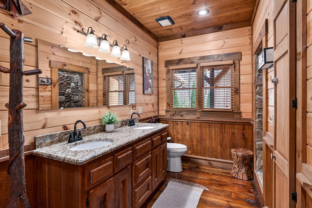 40 Adelaide Trail Blue Ridge, GA 30513 - Photo 15 of 32 a bathroom with a granite countertop sink and a mirror